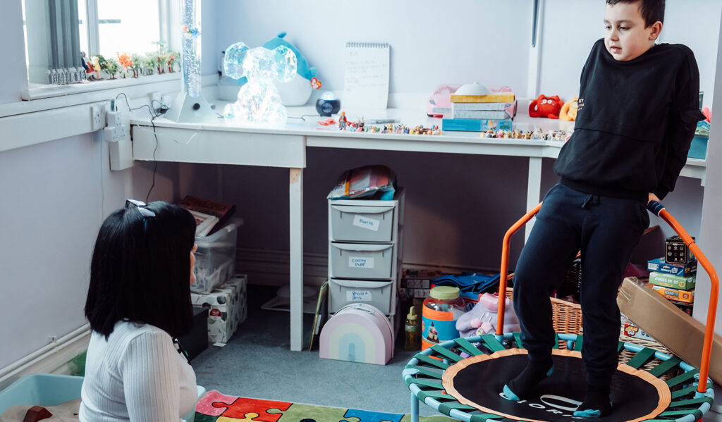 Dr Claire Stubbs working with a child after ADHD diagnosis